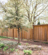 Photo of a solid wood privacy fence.