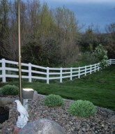 Photo of a white residential fence.