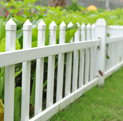 Photo of a white backyard fence.