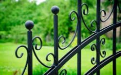 An ornate metal fence installed by a fence company in Normal IL