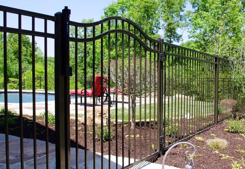 An Ameristar ornamental steel fence installed by a pool in Central Illinois