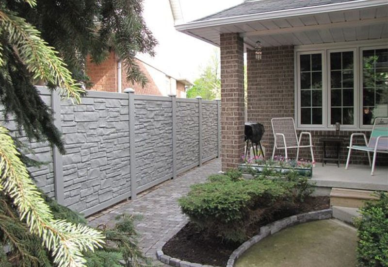 SimTek Ecostone fencing, designed to emulate the look and durability of stone fencing