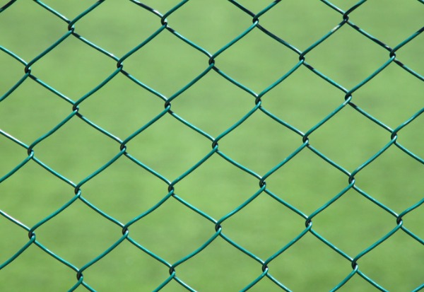 A close up of aluminum chain link fencing with vinyl cover