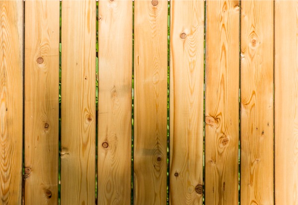 A closeup of a treated cedar wood fence in Illinois installed by Hohulin Fence