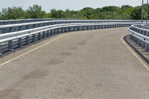 A modern roadway with new highway guardrails in Central Illinois, installed by Hohulin Fence