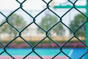 A chain link fence is seen. Hohulin Fence installs chain link fence.