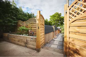 Fence Companies East Peoria IL 1 A beautiful wooden fence and gate are seen. Hohulin Fence is the best of the Fence Companies in East Peoria IL.