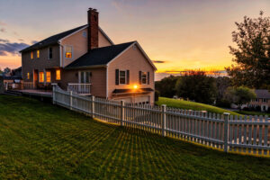Fencing Champaign IL, Beautiful colonial American house at sunset